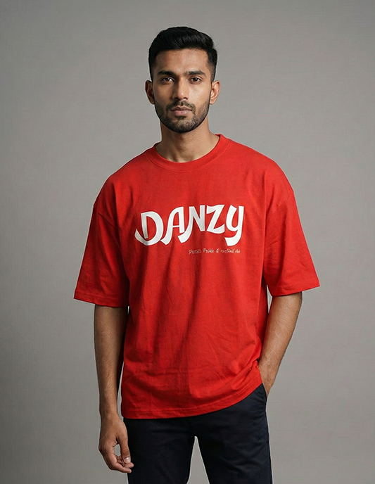 Man wearing a red t-shirt with 'DANZY' printed on it against a gray background
