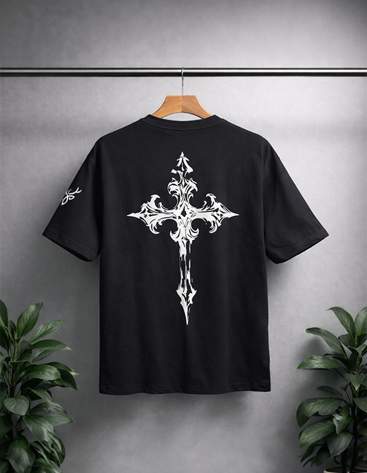 Black t-shirt with white floral design on a hanger against a gray background