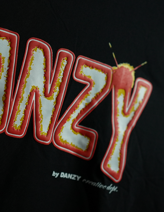 Embroidered patch with 'DANZY' text on a black background