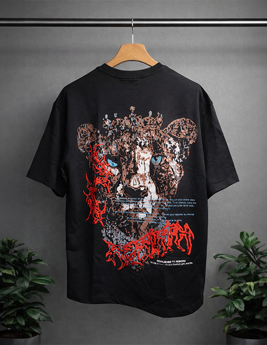 Black t-shirt with a graphic design of a panther's face on a hanger against a gray background.