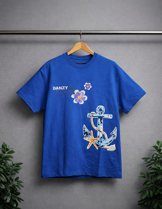 Blue t-shirt with anchor and flower design on a hanger against a gray background