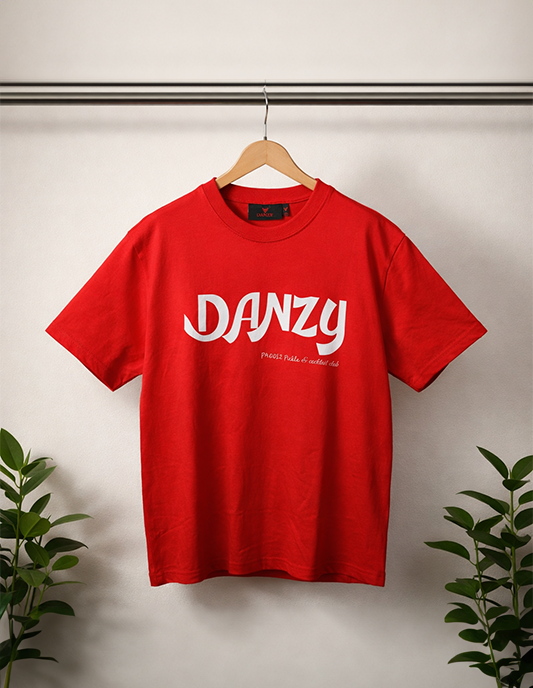 Red t-shirt with 'DANZY' logo on a hanger against a neutral background