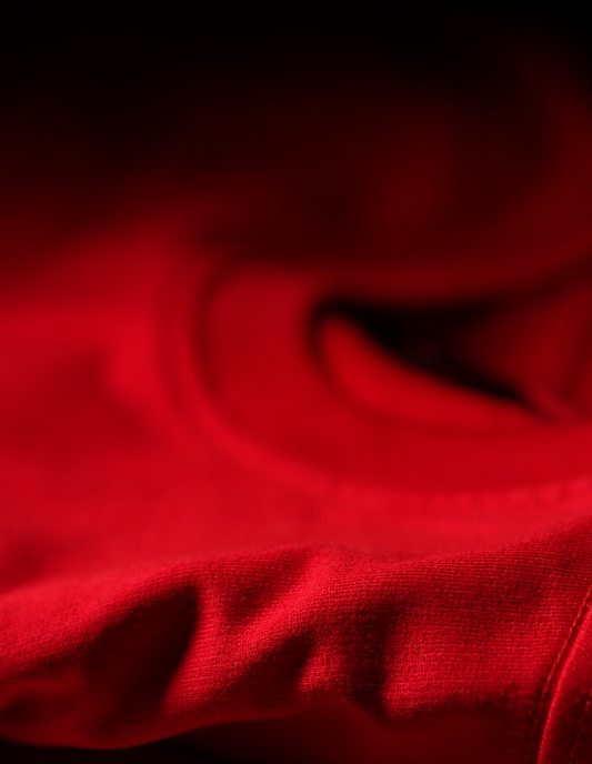 Close-up of red fabric with a dark background